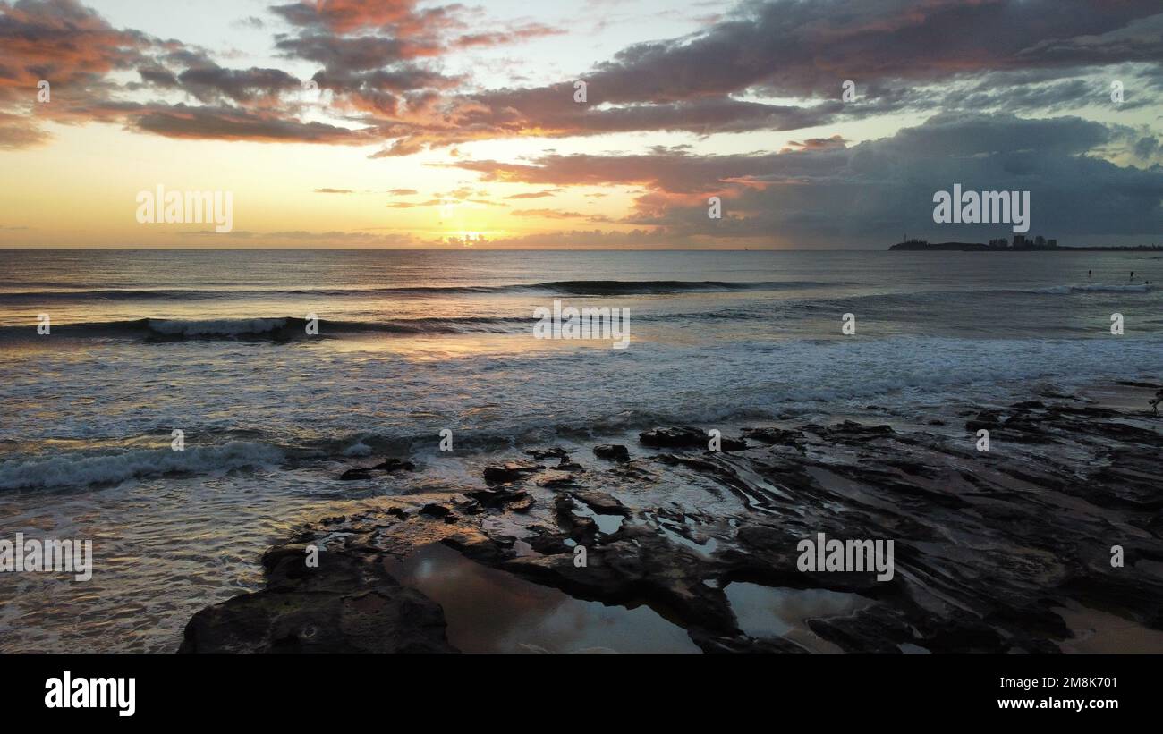 Waves hitting beach sunset shot hi-res stock photography and images - Alamy