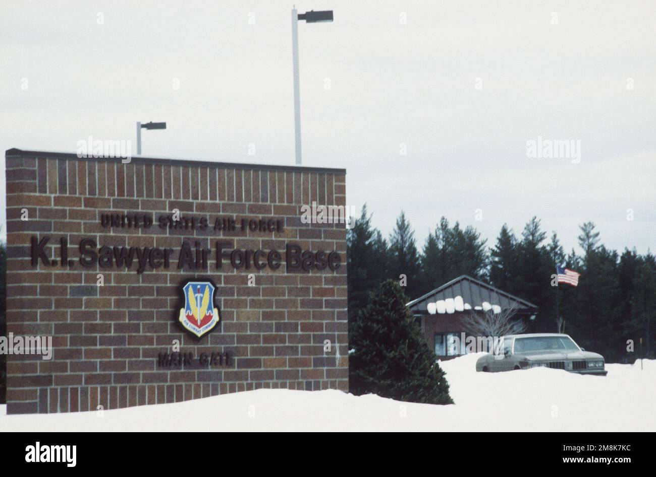 A medium-range view of the main gate with the base sign in the ...