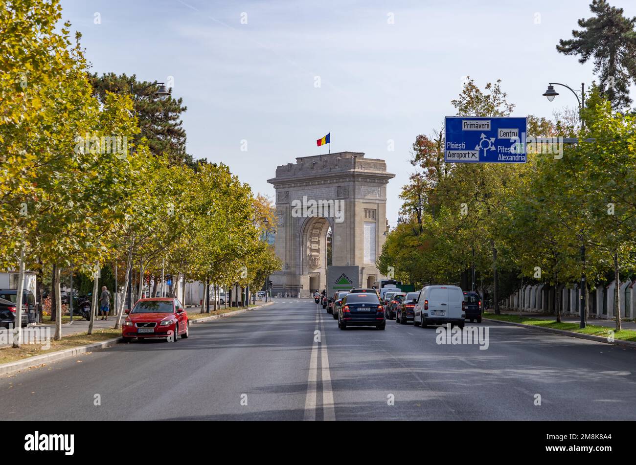 A picture of the Arch of Triumph of Bucharest at the end of the Alexandru Constantinescu Street. Stock Photo