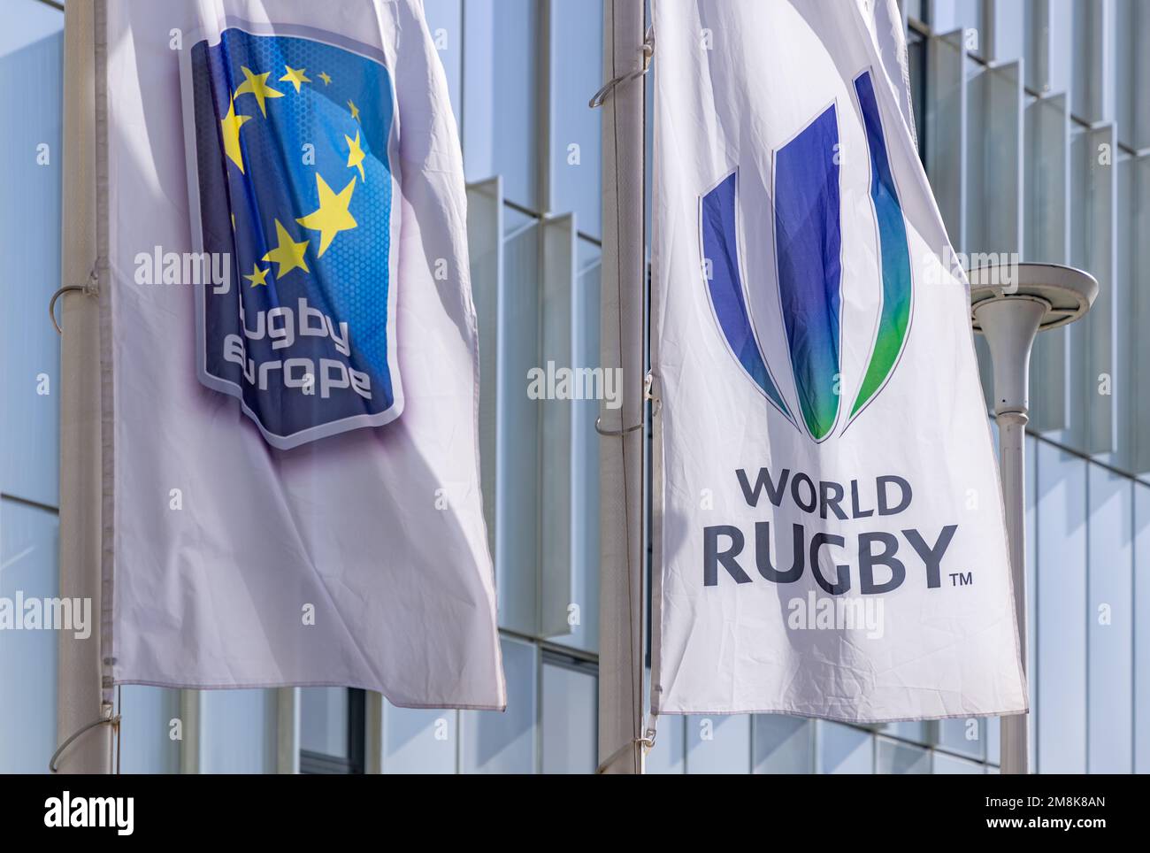 A picture of the Rugby Europe and the World Rugby flags at the Romanian National Rugby Stadium. Stock Photo