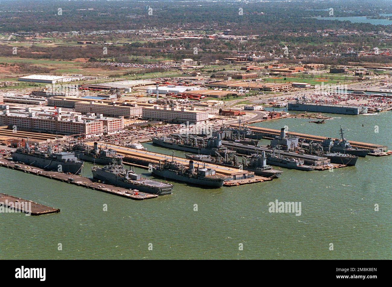 An aerial view of a portion of the Norfolk Naval Station showing piers ...