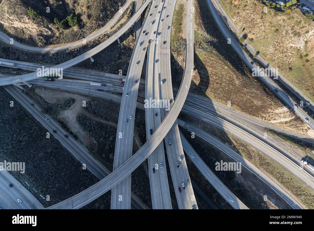 Aerial down view of the Golden State 5 and Antelope Valley 14 freeway interchange bridges in the Newhall Pass north of  Los Angeles California.. Stock Photo