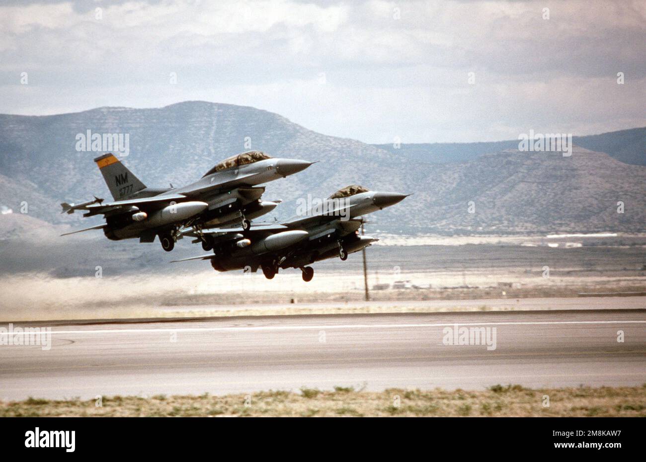 A medium right side view of two US Air Force F16 Fighting Falcons from