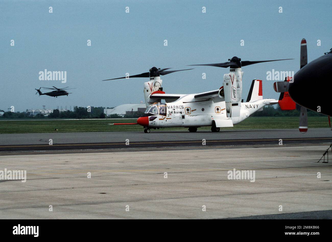 A left side view of a V-22 Osprey tilt-rotor test aircraft taxiing on ...