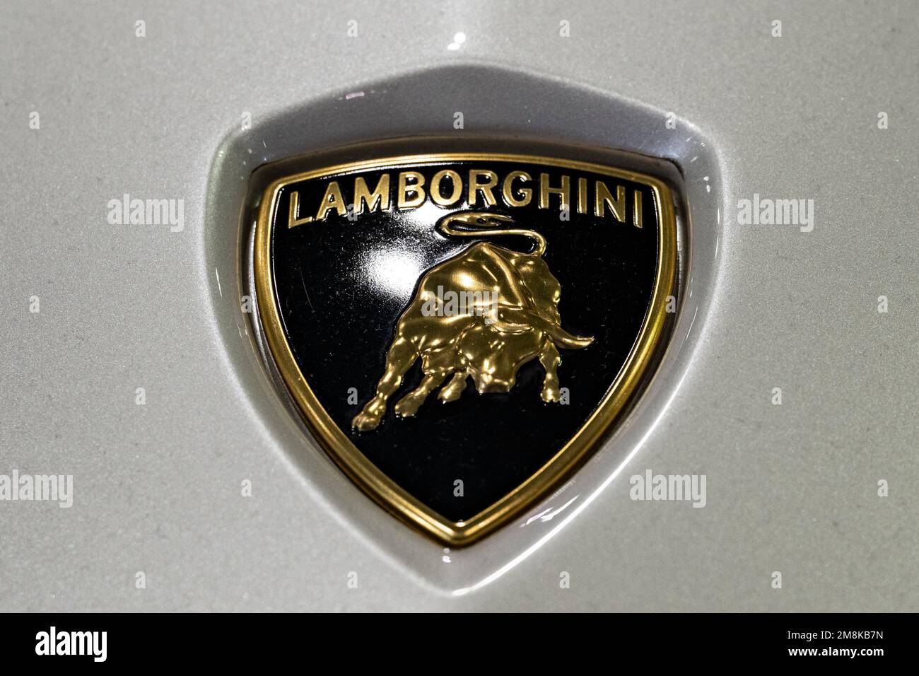 Chiba, Chiba Prefecture, Japan. 13th Jan, 2023. A Lamborghini badge on the hood of a supercar at the Tokyo Auto Salon.Lamborghini is an Italian luxury sports car manufacturer known for its sleek designs, powerful engines, and advanced technology. The company was founded in 1963 by Ferruccio Lamborghini and is now a subsidiary of the Volkswagen Group. Lamborghini's most famous models include the Miura, Countach, and Aventador.Tokyo Auto Salon (æ±äº¬ã‚ªãƒ¼ãƒˆã‚µãƒ-ãƒ³) is considered one of the most prestigious aftermarket car shows in the world, attracting car enthusiasts, manufacturers, Stock Photo
