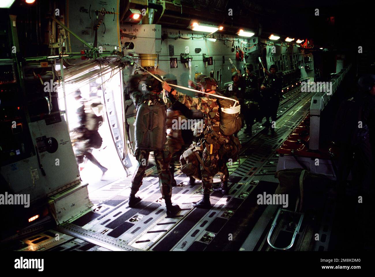 U s army paratroopers from the 82nd airborne division exit the door of