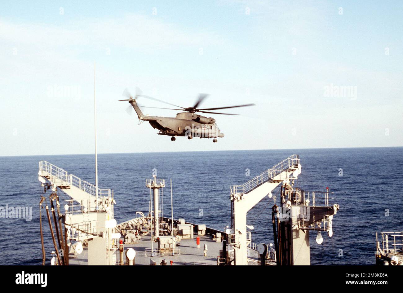 A US Air Force Special Operations MH-53 Pave Low helicopter flies over the USNS LEROY GRUMMAN during a search and seizure exercise with US Navy SEALs.(Exact date shot unknown). Country: Adriatic Sea Stock Photo