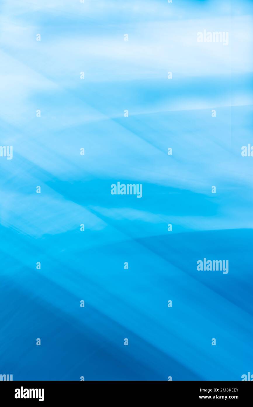 Blue vertical abstract background banner with wave lines crossing and soft gradient. Backdrop Stock Photo