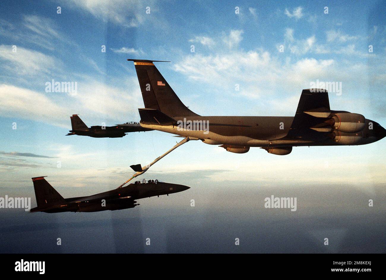 Two US Air Force F-15E Strike Eagles from the 494th Fighter Squadron, Lakenheath Royal Air Force, England, refuel from a KC-135 Stratotanker. The aircraft are flying sorties in support of the enforcement of a NATO no fly zone over Bosnia-Herzegovina. Subject Operation/Series: DENY FLIGHT Country: Adriatic Sea Stock Photo