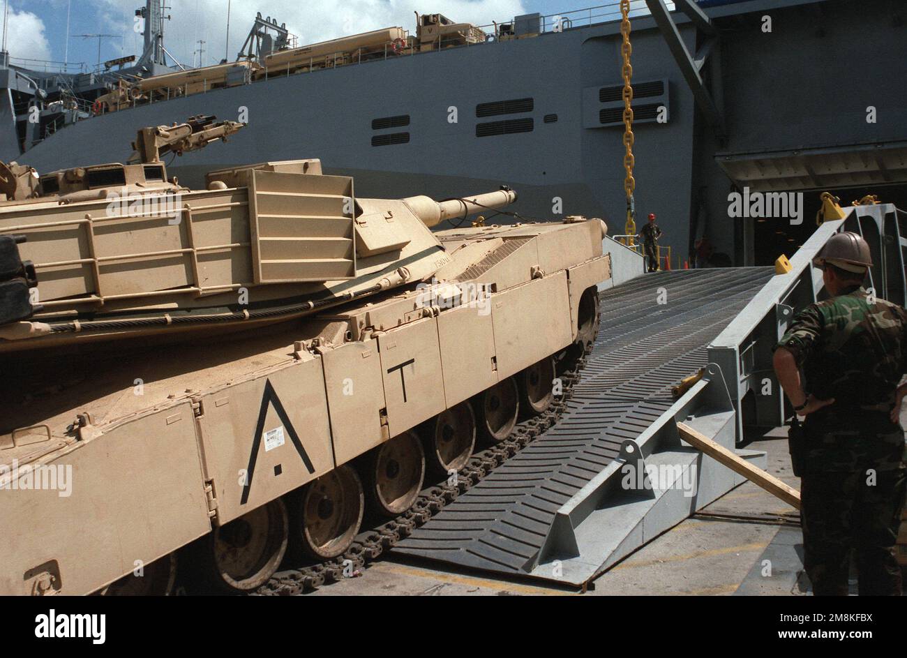 An M1 tank is driven up the ramp onto the US Naval Ship Capella (T-AKR-293) at the Savannah Port. Base: Fort Stewart State: Georgia (GA) Country: United States Of America (USA) Stock Photo