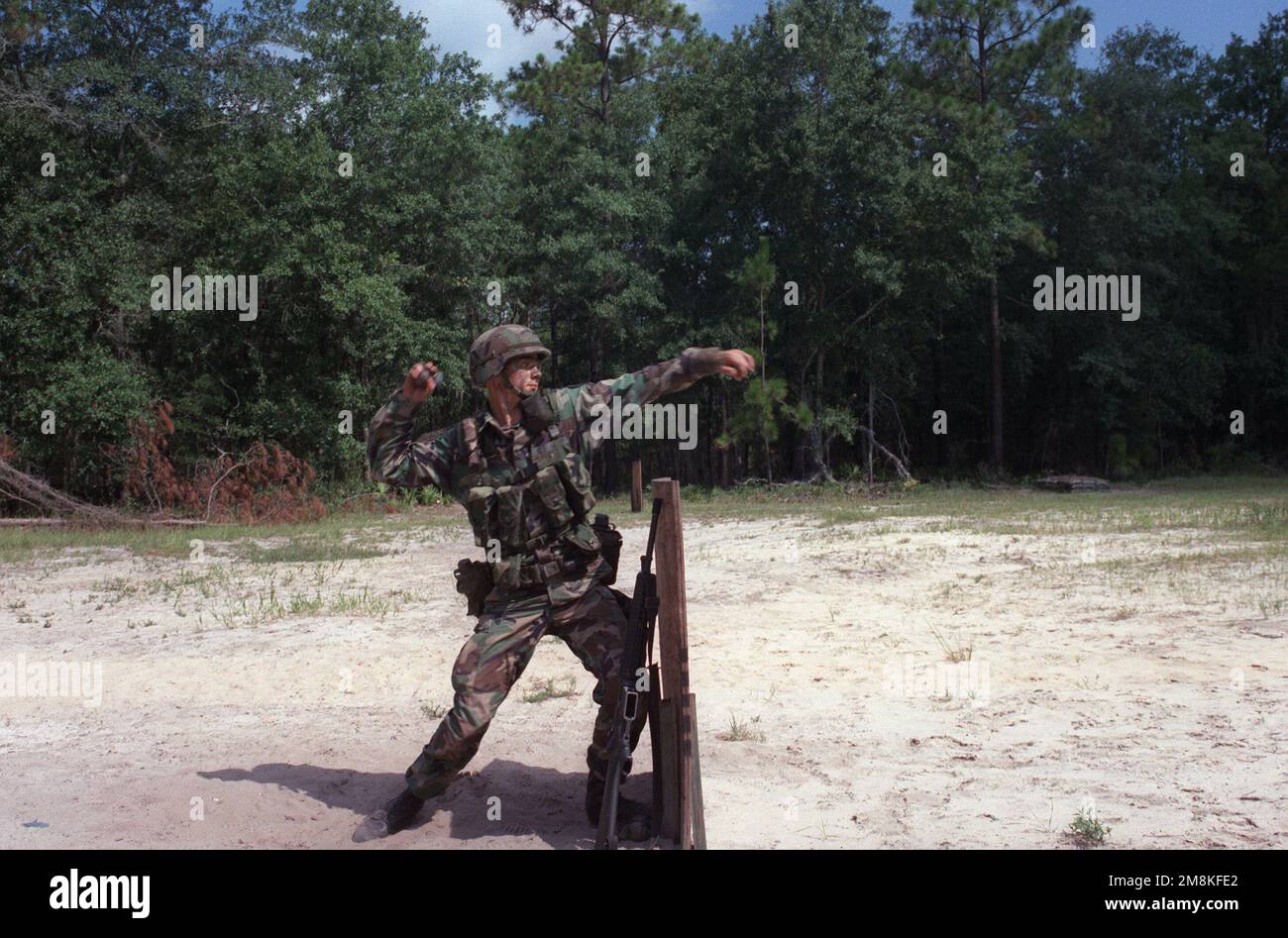 During Expert Infantry Badge (EIB) training, a soldier throws a hand grenade. Base: Fort Stewart State: Georgia (GA) Country: United States Of America (USA) Stock Photo