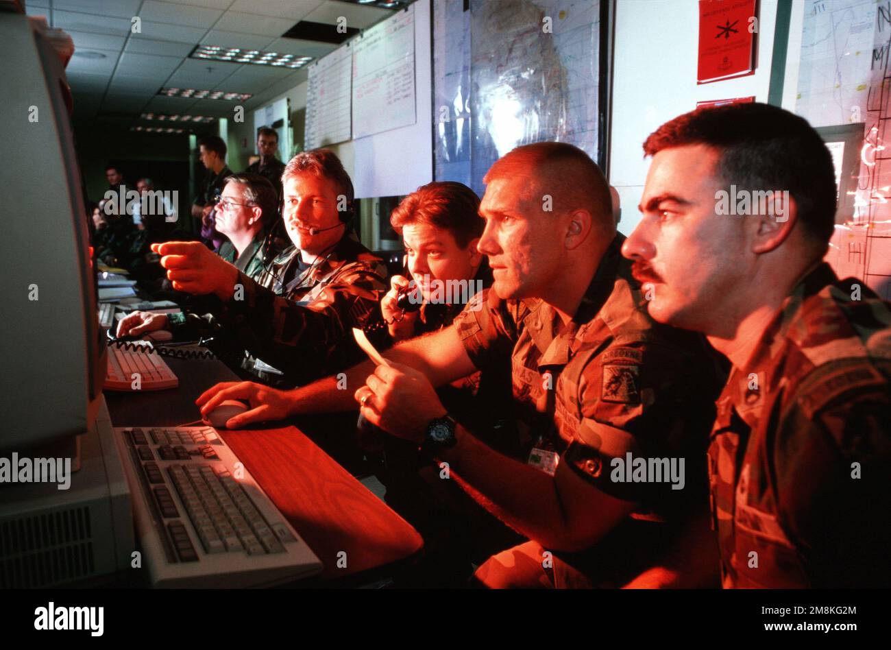 US Air Force STAFF Sergeant Mark Spencer (right, pointing) shows USAF ...