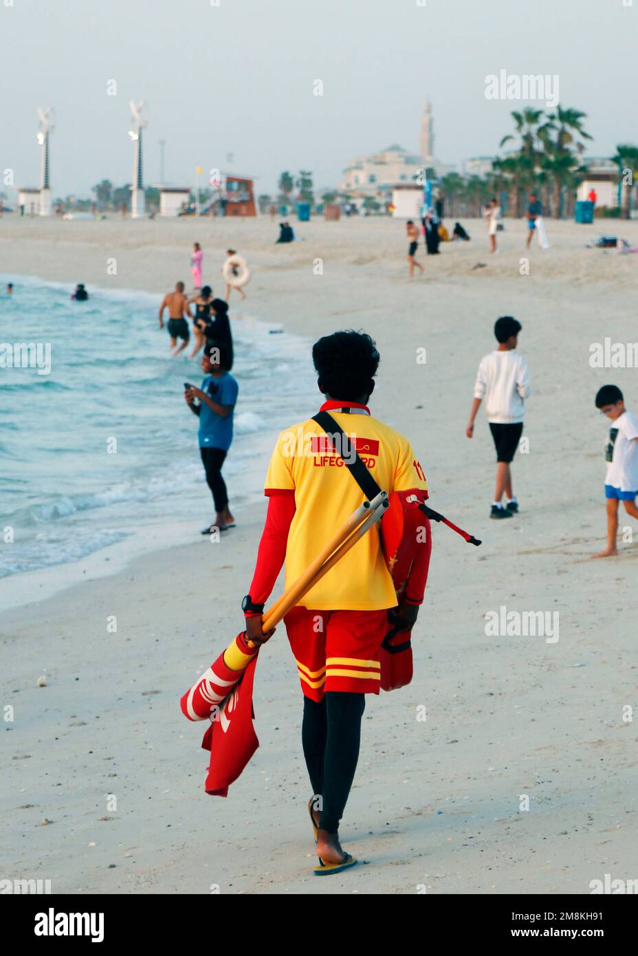 Dubai, United Arab Emirates - August 30, 2022 lifeguard walk around to ensure the safety in a beach Stock Photo