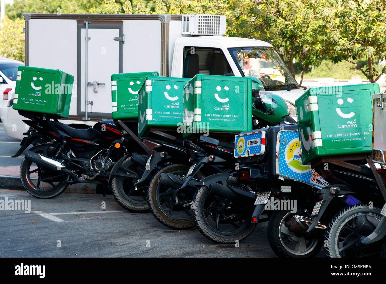 Food home delivery service motorcycles waiting for online order at parking lot Stock Photo