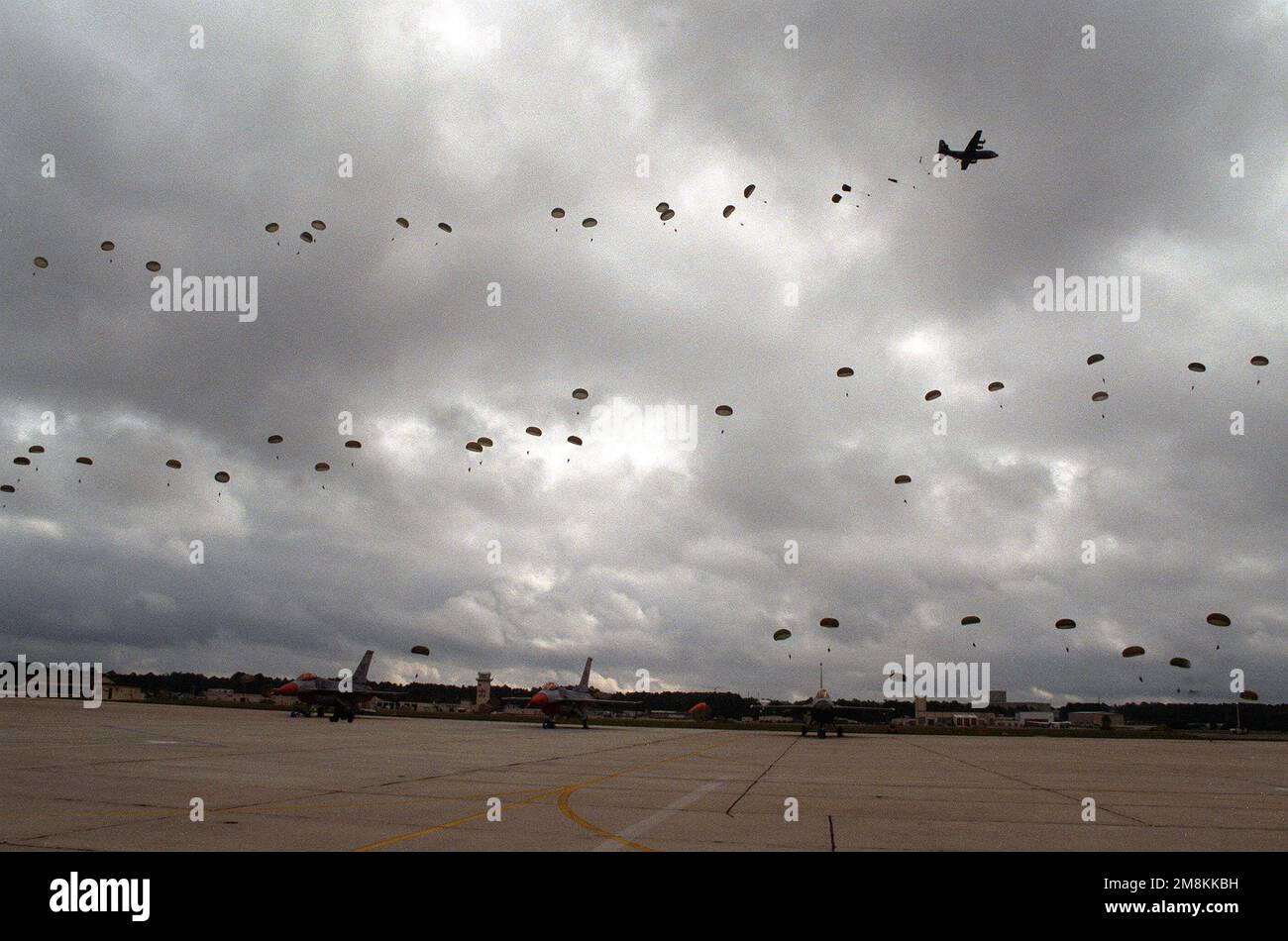 Under black clouds, the wind died down just long enough for a C130