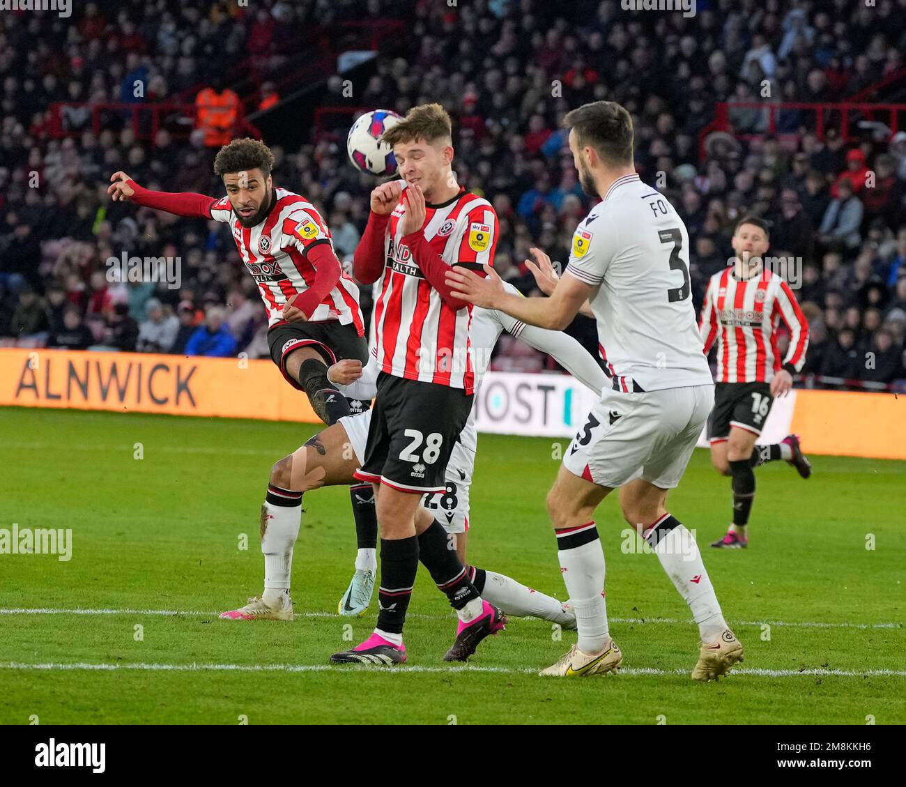 Jayden Bogle #20 of Sheffield United  seeÕs his shot deflect of the head of James McAtee during the Sky Bet Championship match Sheffield United vs Stoke City at Bramall Lane, Sheffield, United Kingdom, 14th January 2023  (Photo by Steve Flynn/News Images) Stock Photo