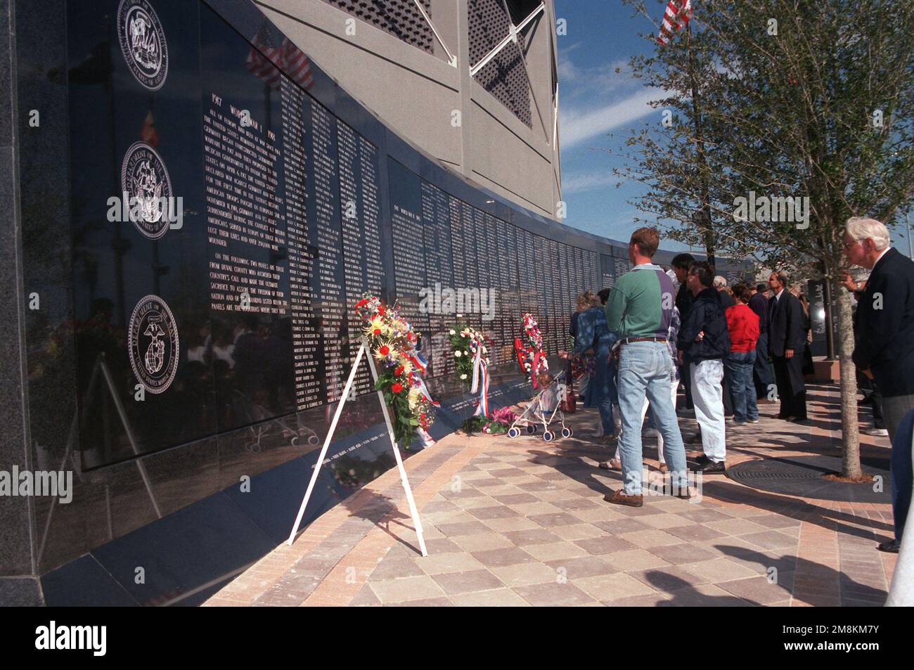 Citizens of Jacksonville attend ceremonies dedicating the Duval County Veterans Memorial Wall in honor of their fallen sons and daughters. Base: Jacksonville State: Florida (FL) Country: United States Of America (USA) Stock Photo