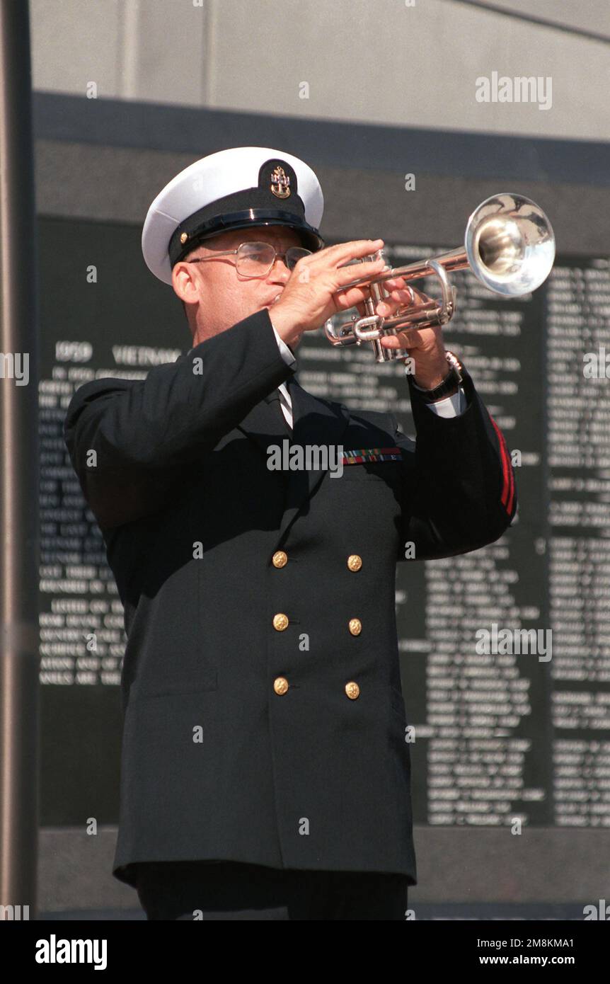 CHIEF Musician (MUC) Gerald D. Engwis plays Taps in honor of fallen veterans of all wars at the conclusion of the dedication of the Duval County Memorial Veterans Wall. Base: Jacksonville State: Florida (FL) Country: United States Of America (USA) Stock Photo