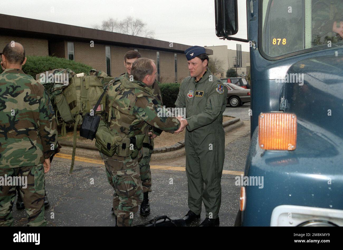 Colonel Tom Chester, Commander, 23rd Aeromedical Evacuation Squadron gives farewell, good luck handshake to Major Richard Stefanski, OIC of the Mobile Aeromedical Staging Facility (MASF) as he prepares to board the bus to transport him to the aircraft and then deployment to Ramstein Air Base, Germany. Major Stefanski will lead his staff and the MASF to Tuzla Air Base, Bosnia and there establish a Mobile Aeromedical Staging Facility (MASF) in support of Operation Joint Endeavor. Subject Operation/Series: JOINT ENDEAVOR Base: Pope Air Force Base State: North Carolina (NC) Country: United States Stock Photo