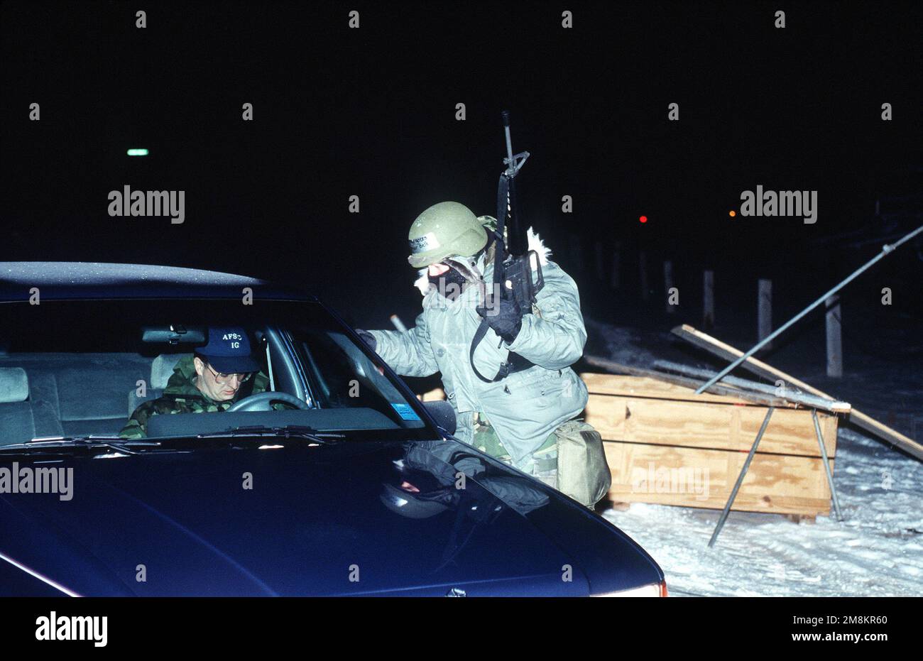 AIRMAN 1ST Class Amber Bell, sentry guard with the 90th MW/CES checks