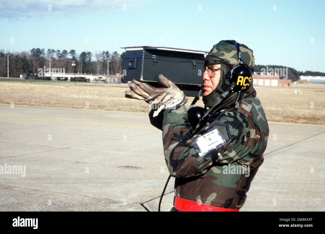 MASTER SGT Hawkins Stands On The Runway And Uses A Portable IFF master-sgt-hawkins-stands-on-the-runway-and-uses-a-portable-iff