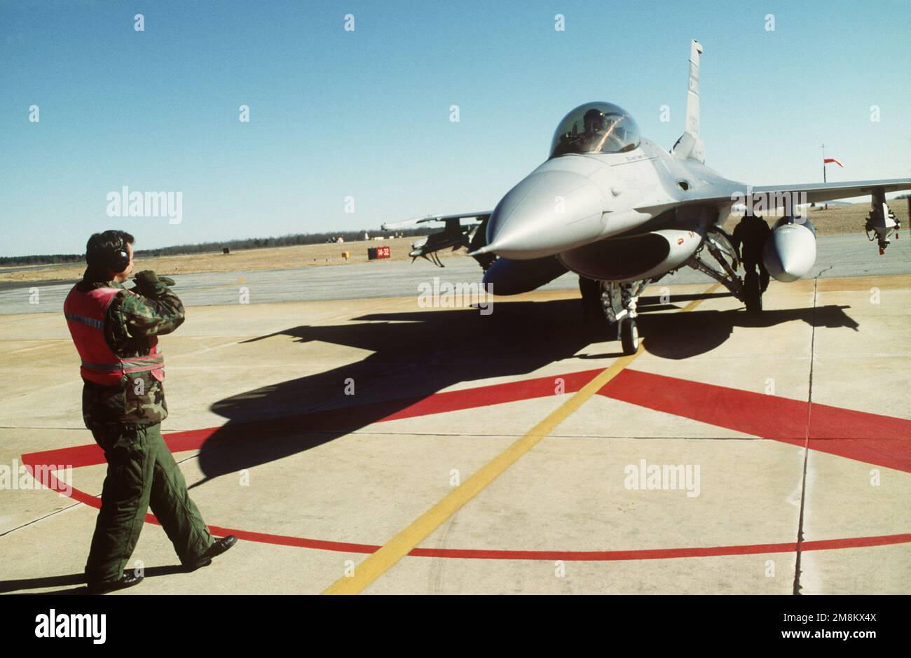 TECH. SGT. Burton performs his End of Runway Inspection on an F-16 ...