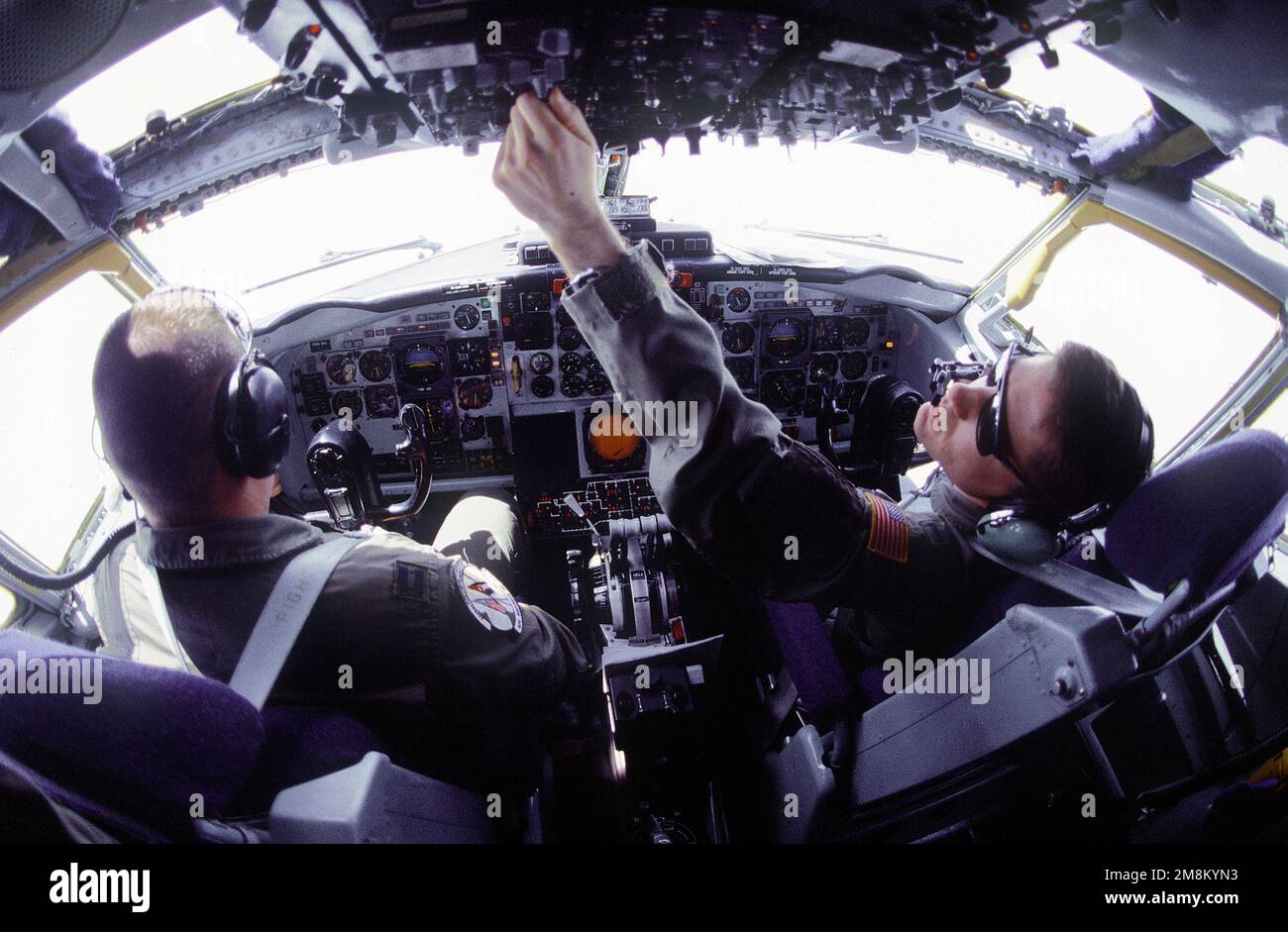 Pilots, Captain Matt T. Stephens (Left, Hometown: Hazlet, New Jersey) and 1ST Lieutenant Ken A. Shugart (Right, Hometown: Desota Texas) from the 96th Air Refueling Squadron, Fairchild Air Force Base, Washington, in the cockpit preflight their KC-135 aircraft prior to a refueling mission over Jordan in support of the Air Power Expeditionary Force. An ancillary mission of the Force is to assist US Air Force and other multinational forces operating in Saudi Arabia and other nearby countries patrol the no-fly zone over southern Iraq. Subject Operation/Series: AIR POWER EXPEDITIONARY FORCE Country: Stock Photo