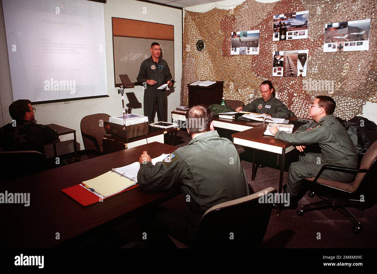 CAPT. Dave Carter, 552nd TRS, conducts a weapons director initial qualification class for (from left) MASTER SGT. Michael Sparks, STAFF SGT. Rodney E. Mayo, CAPT. Mark Matsushima, and STAFF SGT. Chad D. Dearinger.(Published in AIRMAN Magazine May 1996 ) Exact Date Shot Unknown. Base: Tinker Air Force Base State: Oklahoma (OK) Country: United States Of America (USA) Stock Photo