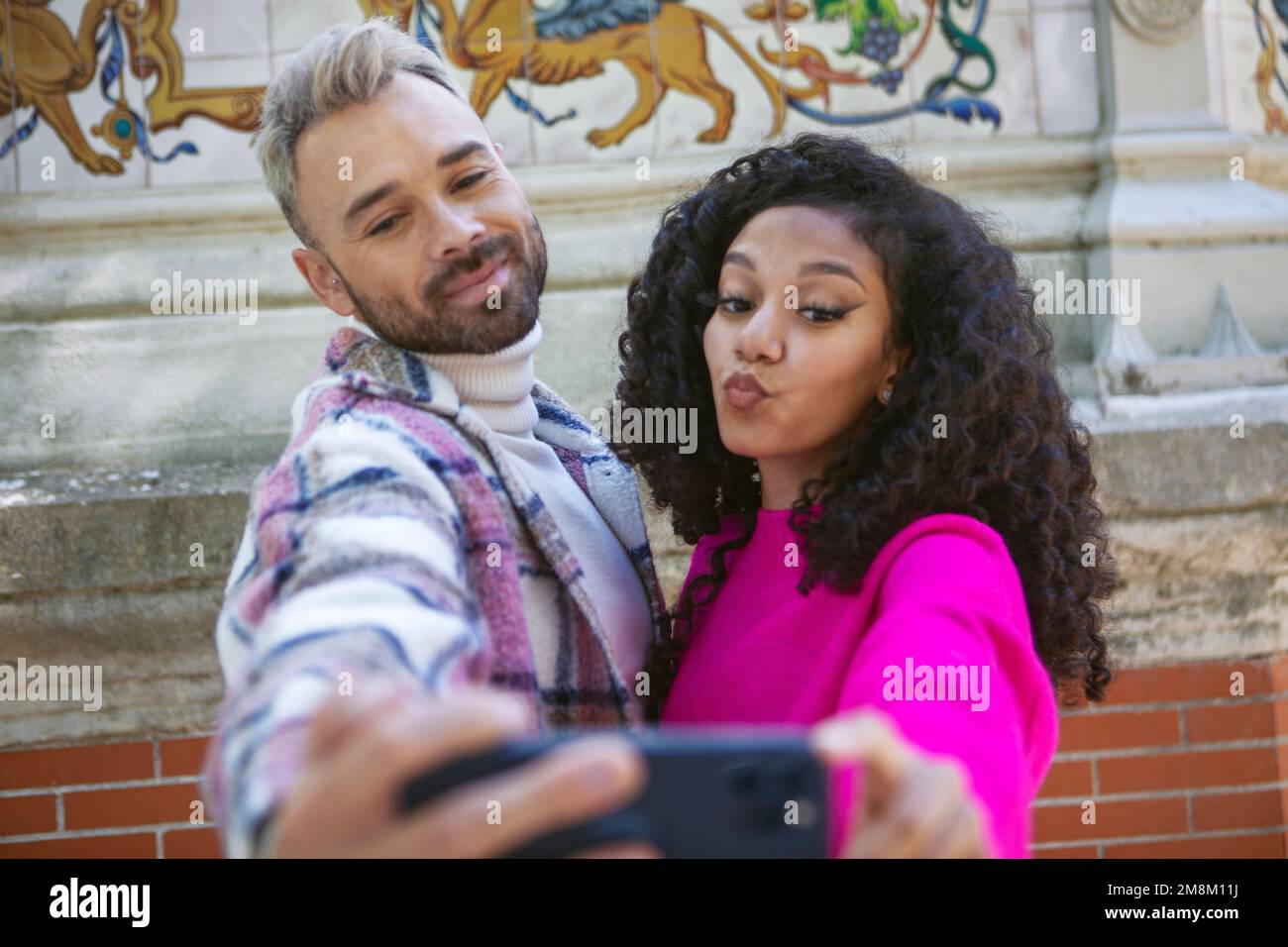 A young couple, taking selfies, making funny faces Stock Photo