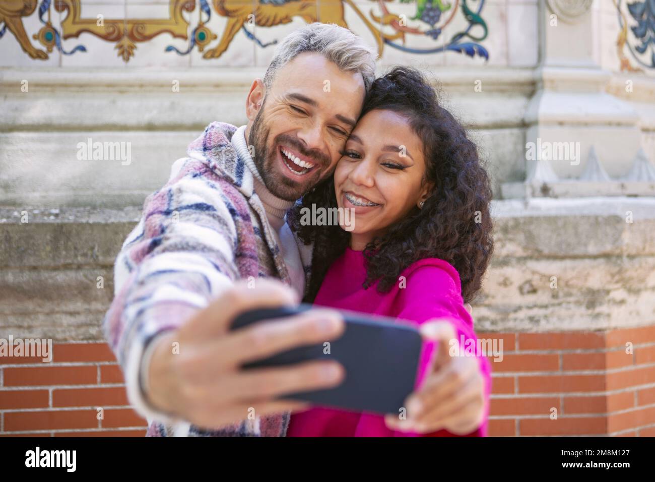A young couple, taking selfies, making funny faces Stock Photo