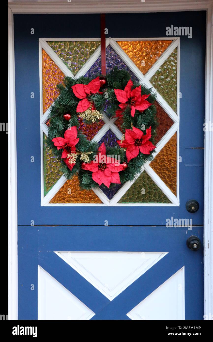 Blue and white dutch door cheerfully decorated for the Christmas season during Julefest in Solvang, CA. Solvang’s Danish history is reflected in the t Stock Photo