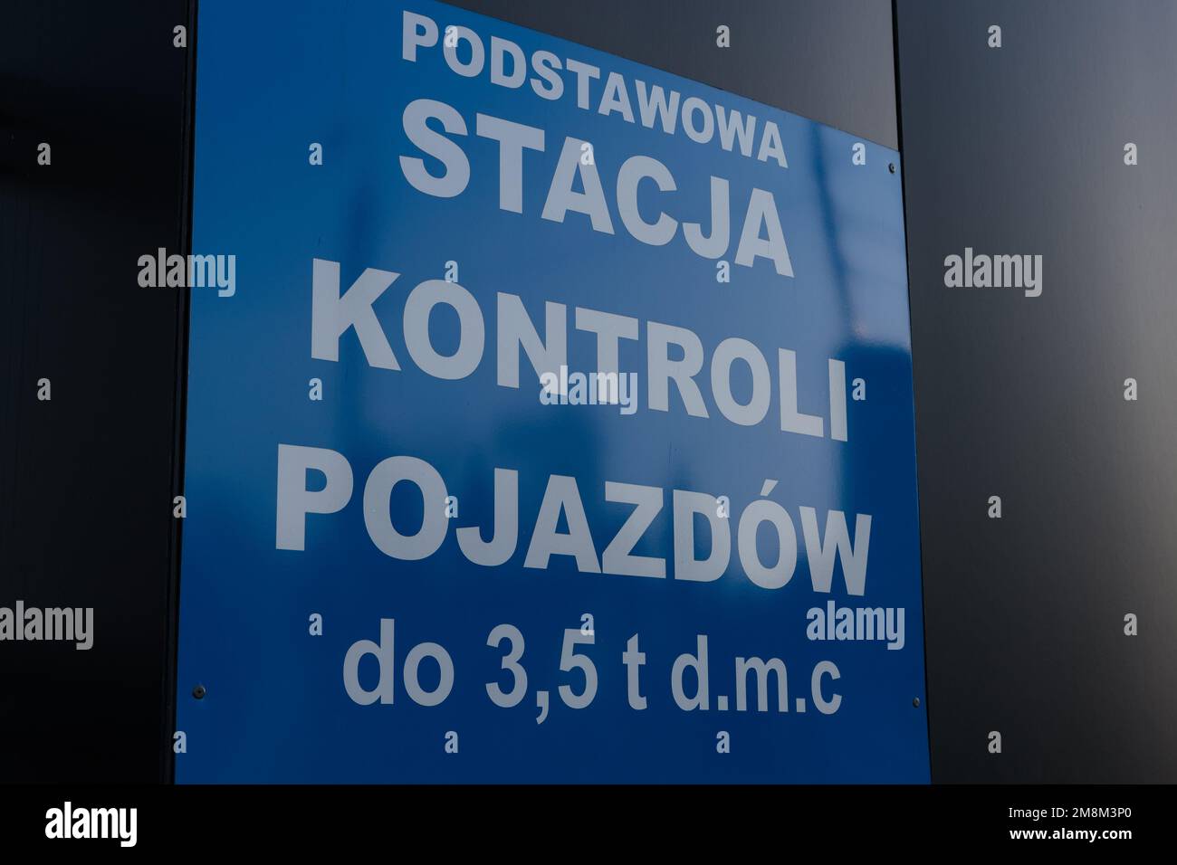 Poland, Poznan - January 01, 2023: A signboard behind the fence, vehicle inspections. Safety on the road. Stock Photo