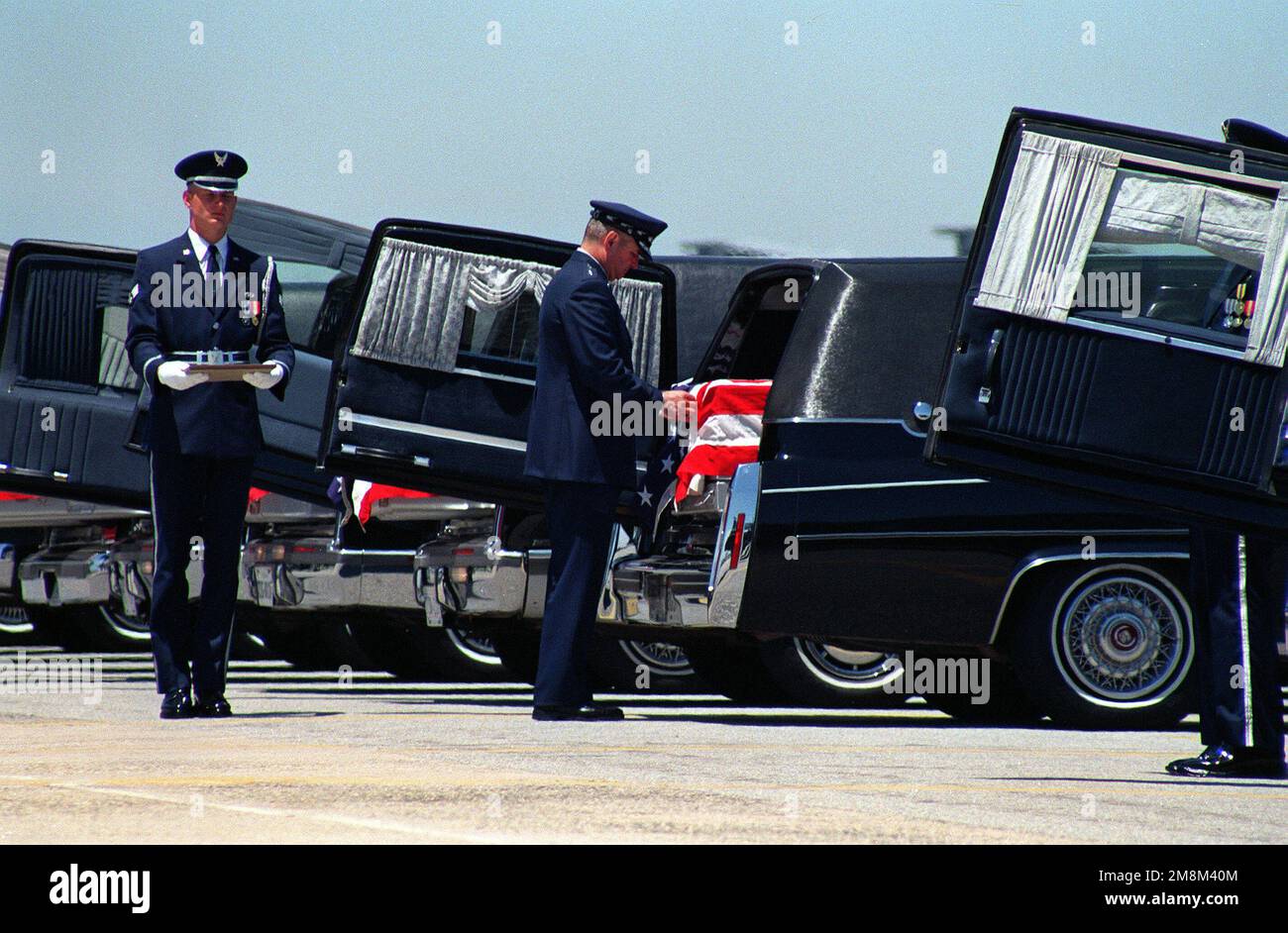 Commander Air Mobility Command, General Ronald R. Fogelman, pins a Purple Heart on one of the nineteen caskets containing the remains of U.S. military service members killed in the Dhahran, Saudi Arabia bombing. The June 27, 1996 memorial services are at Dover air Force Base, Delaware. Base: Dover Air Force Base State: Delaware (DE) Country: United States Of America (USA) Stock Photo