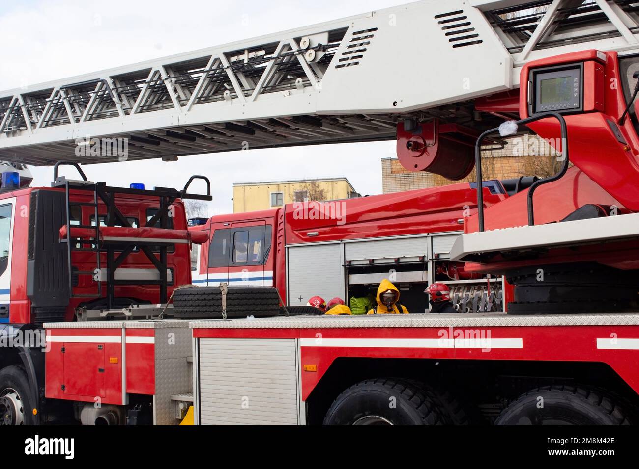 Red fire truck with ladder, equipment and water save lives, put out firess. Stock Photo