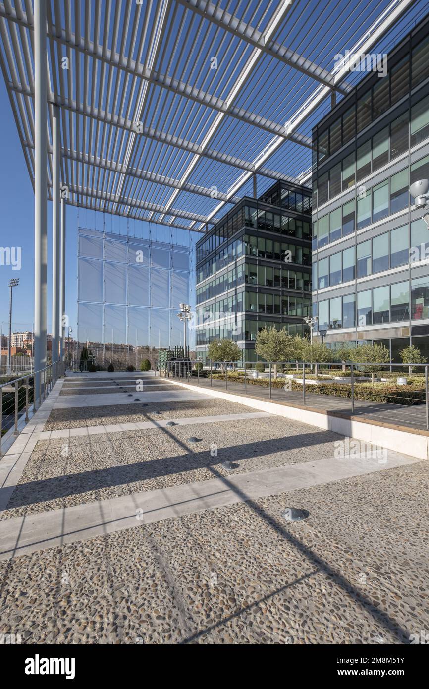 Office buildings with glass and metal facades with latticework and metal roofs Stock Photo