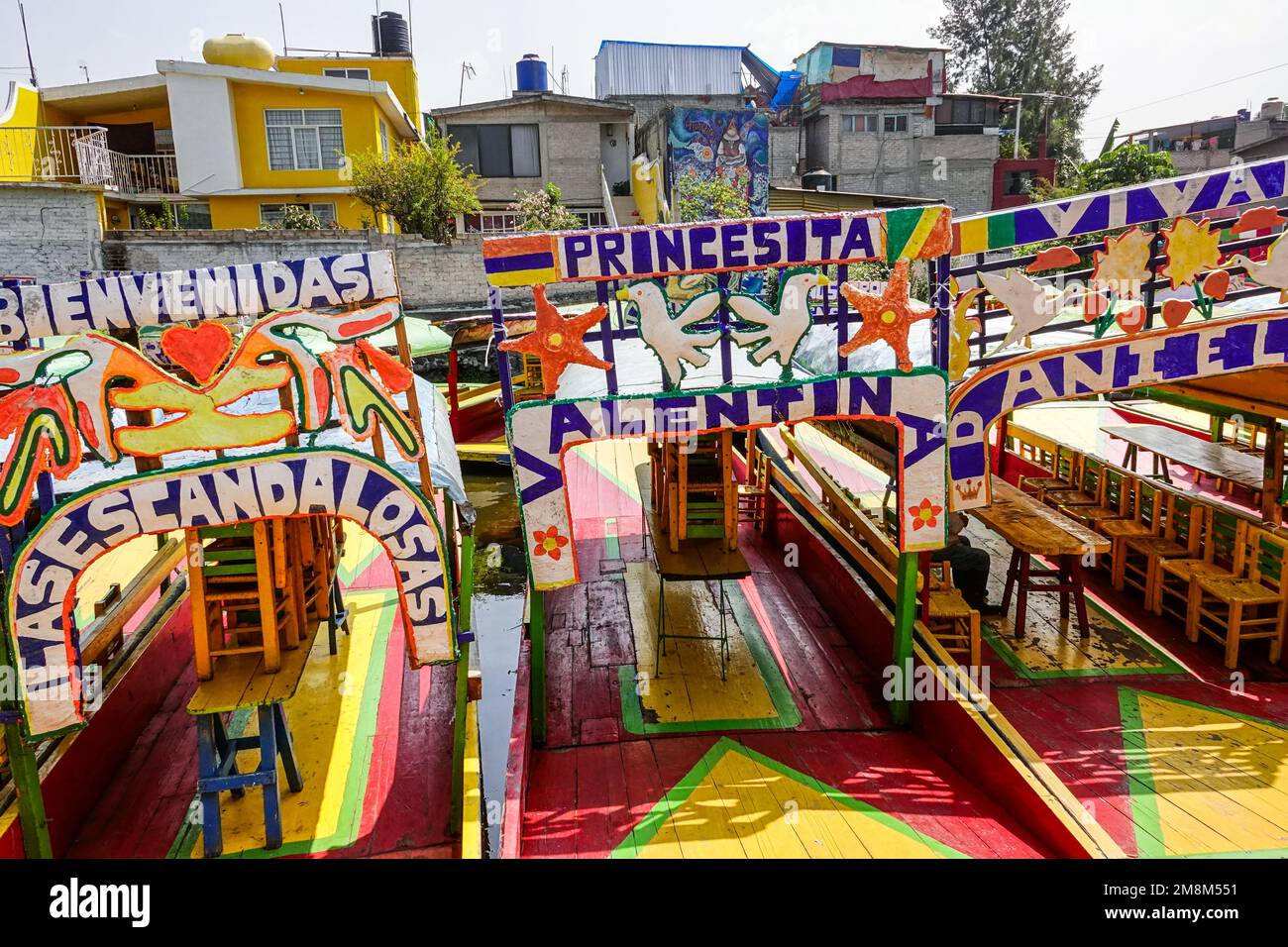 Colorful painted trajinera boats waiting for tourists to travel the