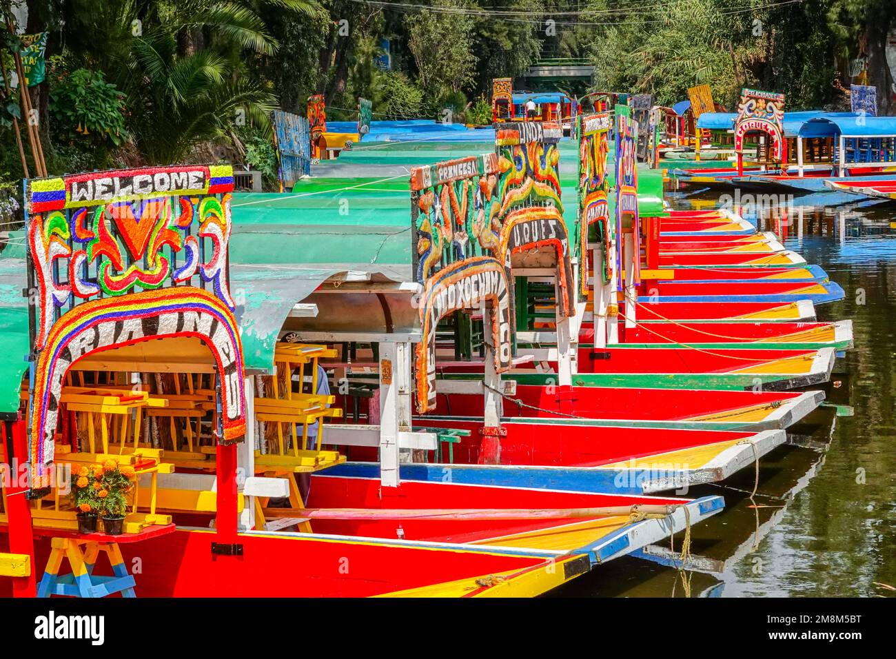 Colorful painted trajinera boats waiting for tourists to travel the