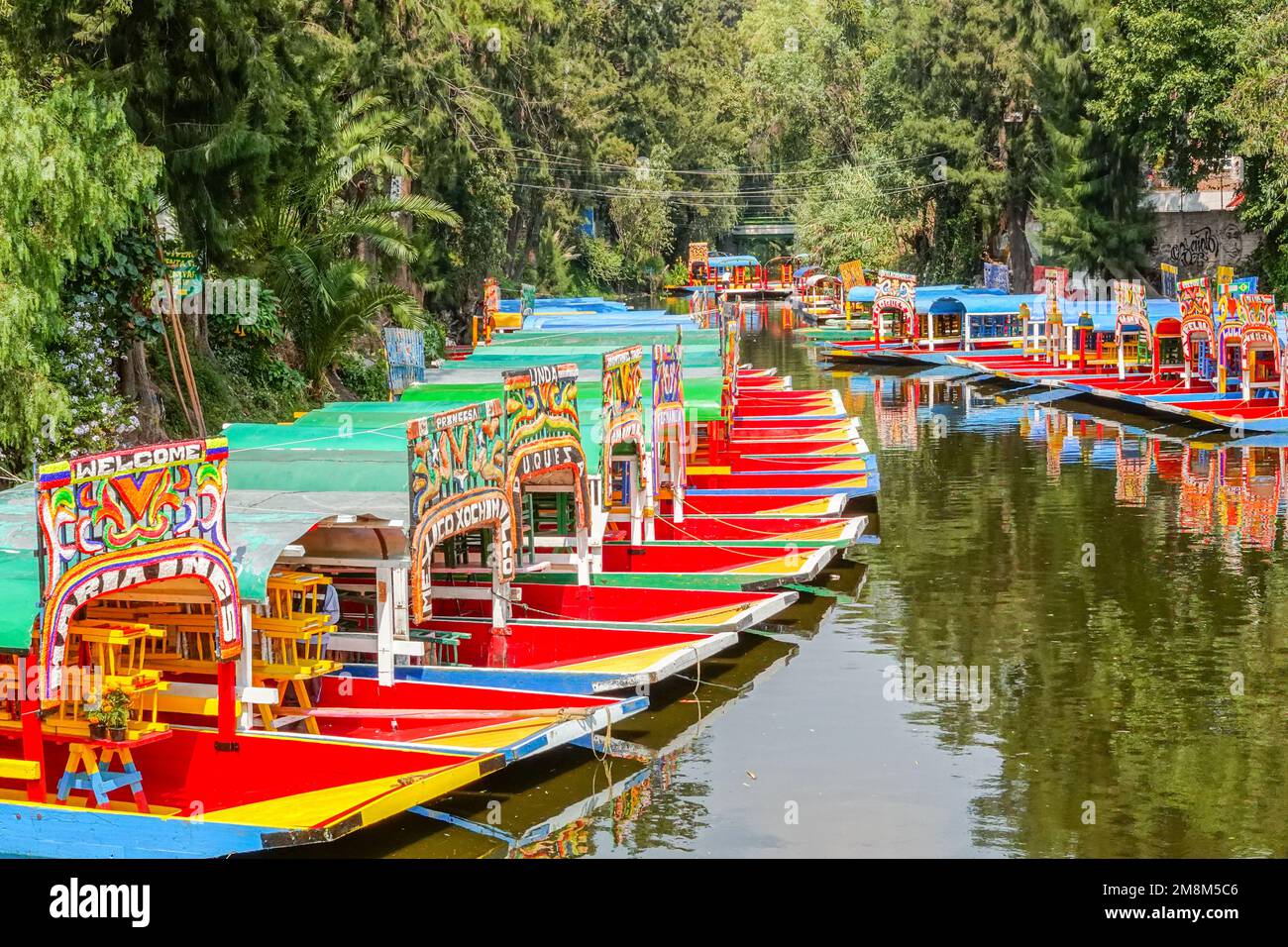 Colorful painted trajinera boats waiting for tourists to travel the