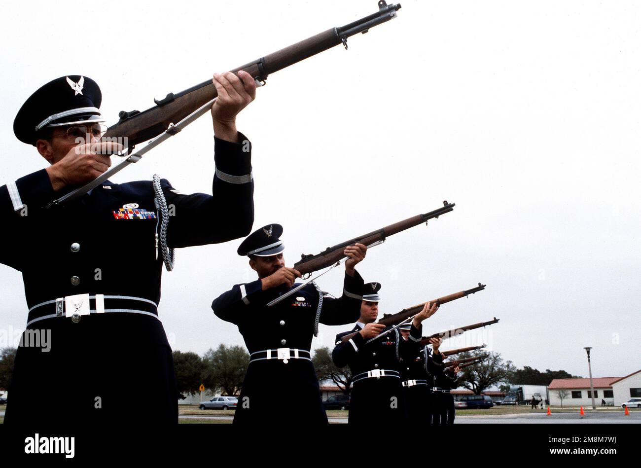 The Honor Guard aim their weapons. In FY 96 they participated in over 380 special events ranging from parades to sporting events including 231 funerals. The team is also an excellent recruiting tool in attracting the young people in the community to the Air Force. Base: Randolph Air Force Base State: Texas (TX) Country: United States Of America (USA) Stock Photo