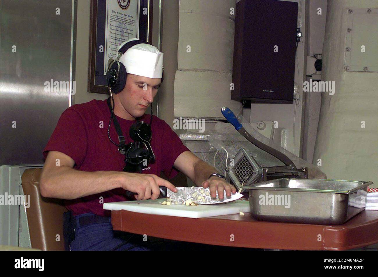 US Navy SEAMAN Recruit William Kraft prepares breakfast while standing phone watch duties on board the US Navy's nuclear powered ballistic submarine, USS RHODE ISLAND (SSBN 740). Base: USS Rhode Island (SSBN 740) Stock Photo