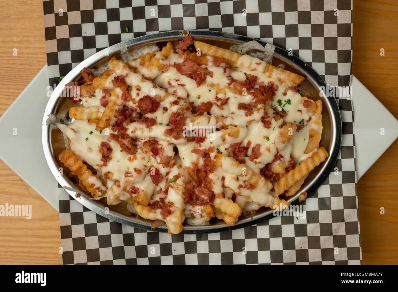 Fries with cheese and bacon Stock Photo
