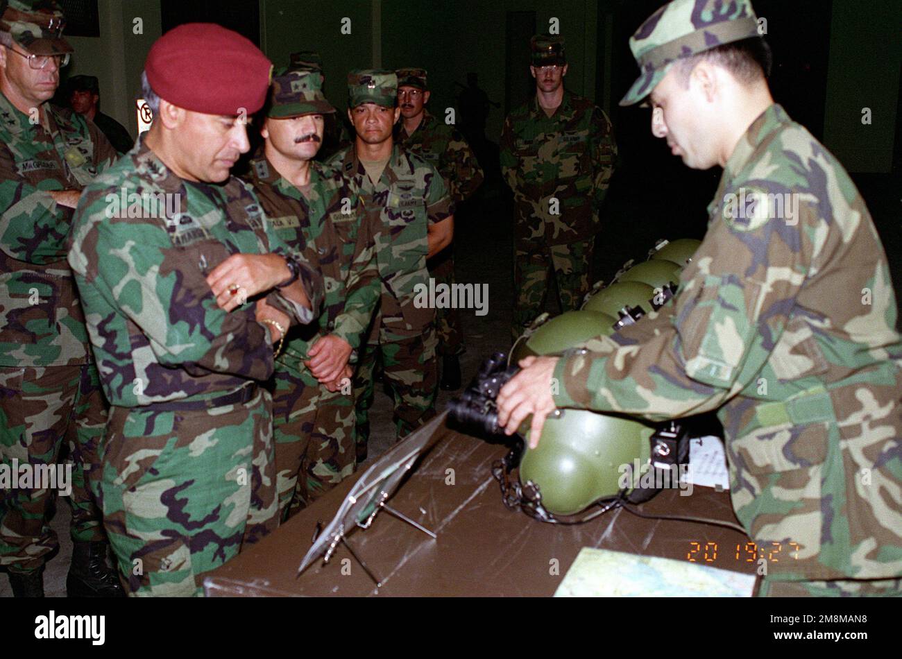 Major General Lawson Magruder III, Commander, Army South, looks on as Brigadier General Sergio Arnoldo Camargo Murralles, CHIEF of STAFF, Guatemalan Army is briefed by CHIEF Warrant Office Montufar on the operation of Night vision (an/vis-6) Goggles installed on a flight helmet. Brig. GEN. Murralles was on a visit to U.S. Army Southern Command. Base: Fort Clayton Country: Panama (PAN) Stock Photo