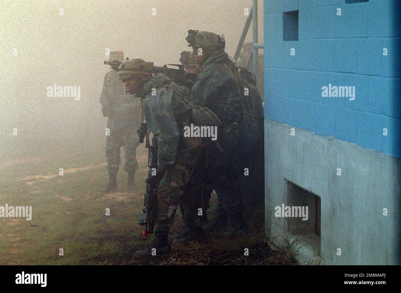 Soldiers from the 82nd Airborne Division pop smoke canisters to conceal ...