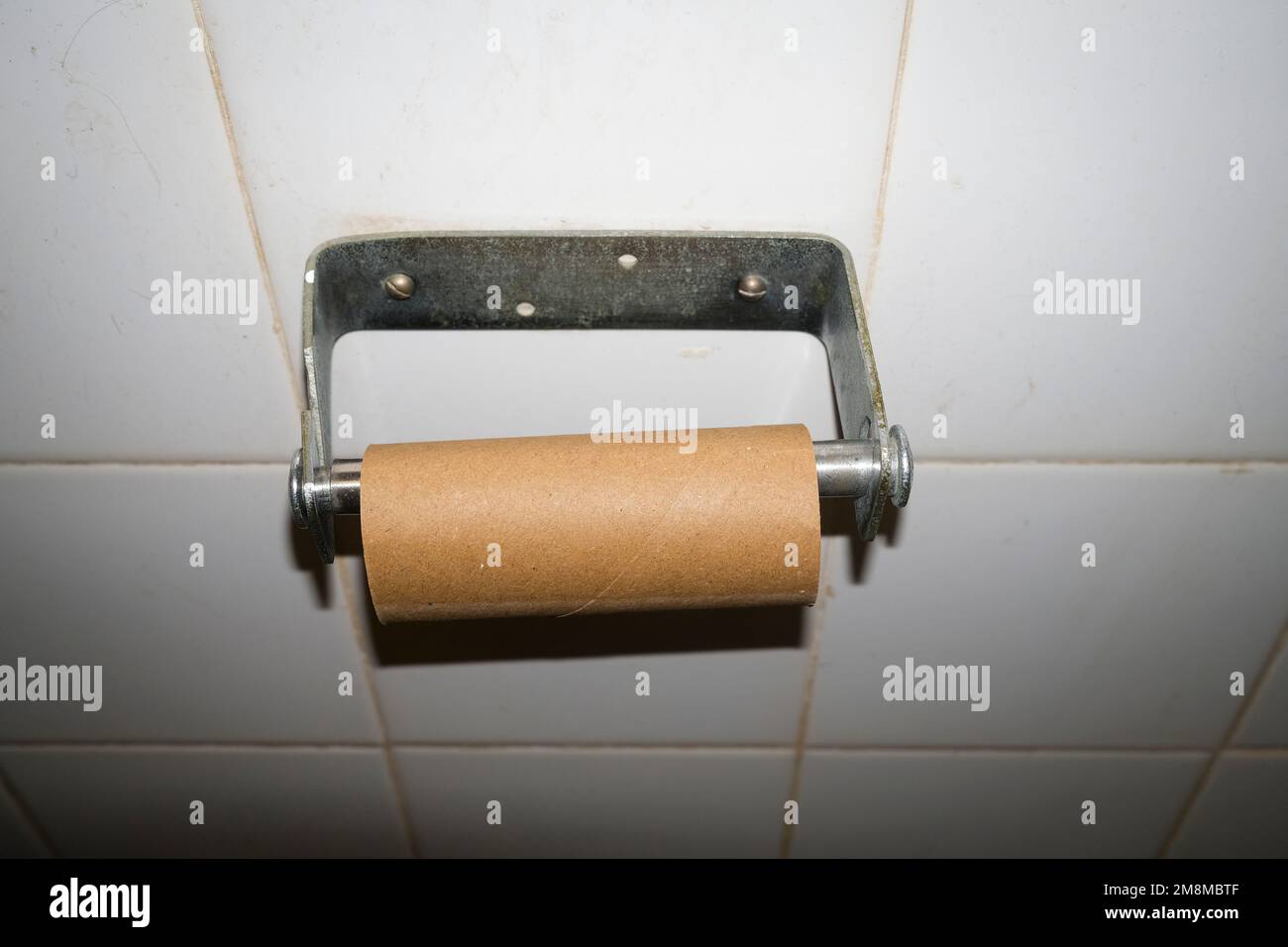 Empty toilet paper roll holder Stock Photo