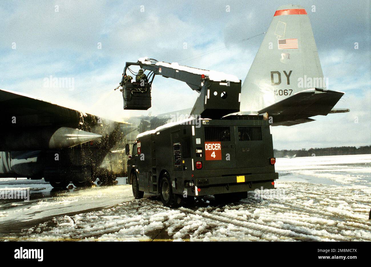Deicer truck #4 deices the wing of a C-130 Hercules. Snow and ice prove to be a challenge to maintainers as well as to the crews. Deicing is an everyday task during the 39th Airlift Squadron's rotation from October through December. Subject Operation/Series: JOINT ENDEAVOR Base: Ramstein Air Base State: Rheinland-Pfalz Country: Deutschland / Germany (DEU) Stock Photo