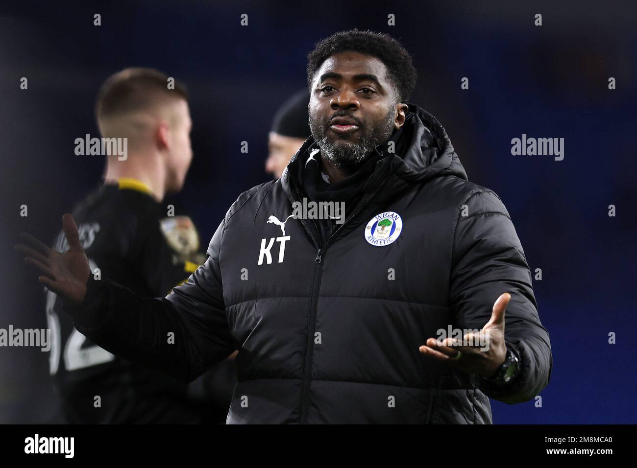 Cardiff, UK. 14th Jan, 2023. Kolo Toure, the manager of Wigan Athletic thanks the Wigan fans after the game. EFL Skybet championship match, Cardiff city v Wigan Athletic at the Cardiff City Stadium in Cardiff, Wales on Saturday 14th January 2023. this image may only be used for Editorial purposes. Editorial use only, license required for commercial use. No use in betting, games or a single club/league/player publications. pic by Andrew Orchard/Andrew Orchard sports photography/Alamy Live news Credit: Andrew Orchard sports photography/Alamy Live News Stock Photo
