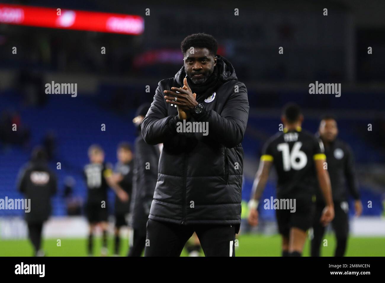 Cardiff, UK. 14th Jan, 2023. Kolo Toure, the manager of Wigan Athletic applauds the Wigan fans after the game. EFL Skybet championship match, Cardiff city v Wigan Athletic at the Cardiff City Stadium in Cardiff, Wales on Saturday 14th January 2023. this image may only be used for Editorial purposes. Editorial use only, license required for commercial use. No use in betting, games or a single club/league/player publications. pic by Andrew Orchard/Andrew Orchard sports photography/Alamy Live news Credit: Andrew Orchard sports photography/Alamy Live News Stock Photo