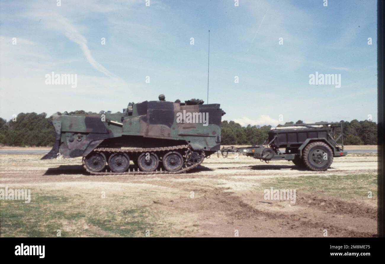 A M9 ACE (Armored Combat Earthmover) pulling a mine charge system during a capabilities exercise. Subject Operation/Series: CAPEX 92 Base: Marine Corps Base, Camp Lejeune State: North Carolina (NC) Country: United States Of America (USA) Stock Photo