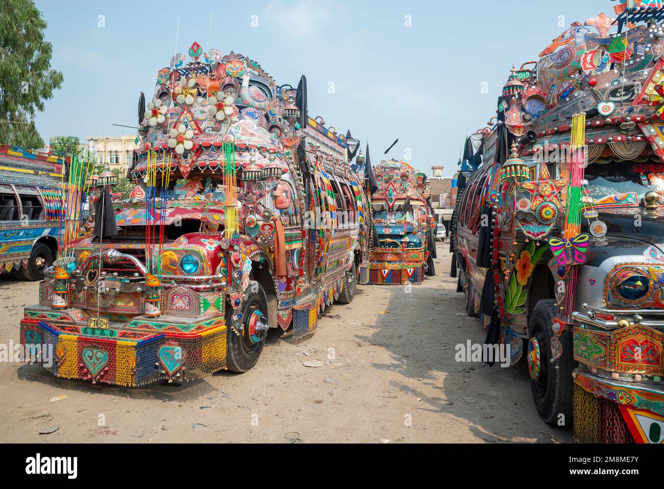 Colorfully painted buses at a bus station, Peshawar, Pakistan Stock Photo