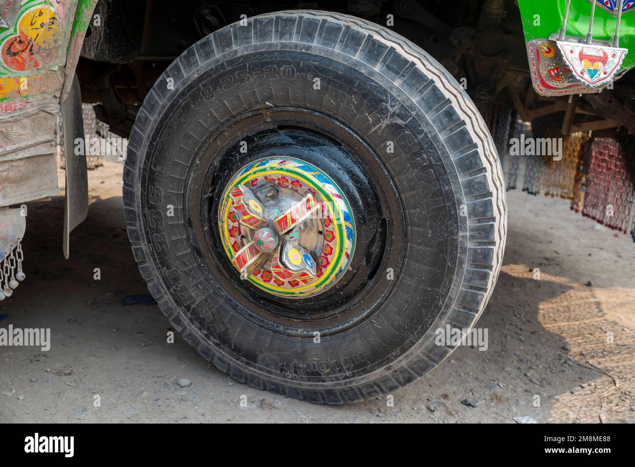 Detail of a decorated wheel rim of a painted painted bus, Peshawar, Pakistan Stock Photo